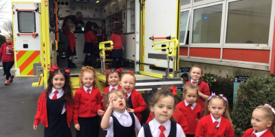 Primary one pupils posed outside of NIAS ambulance