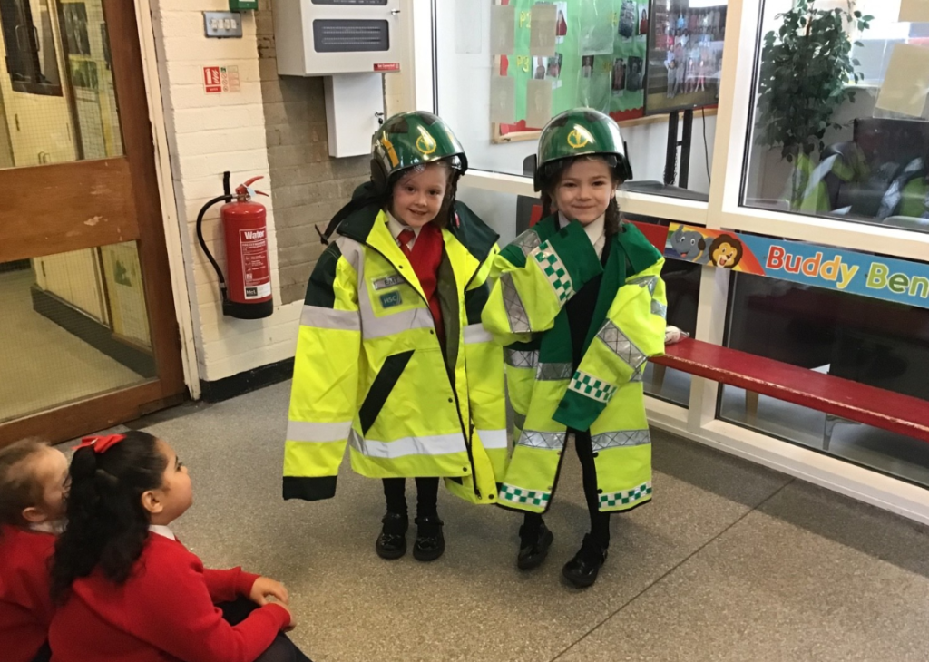 Children try on NIAS uniform