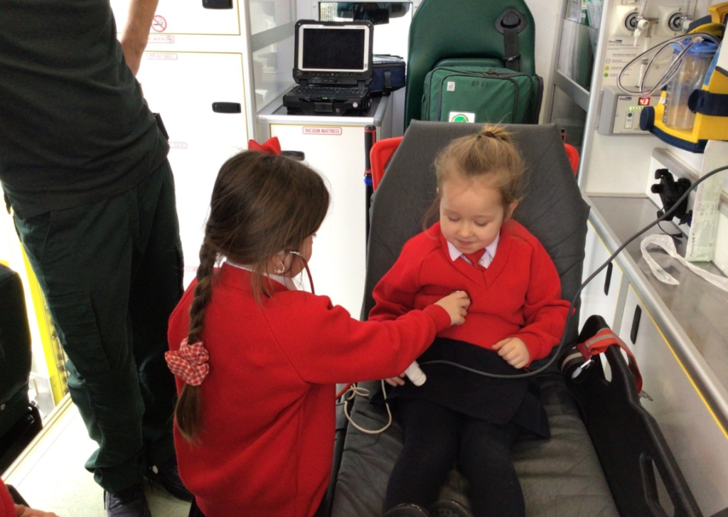 Children playing in an ambulance
