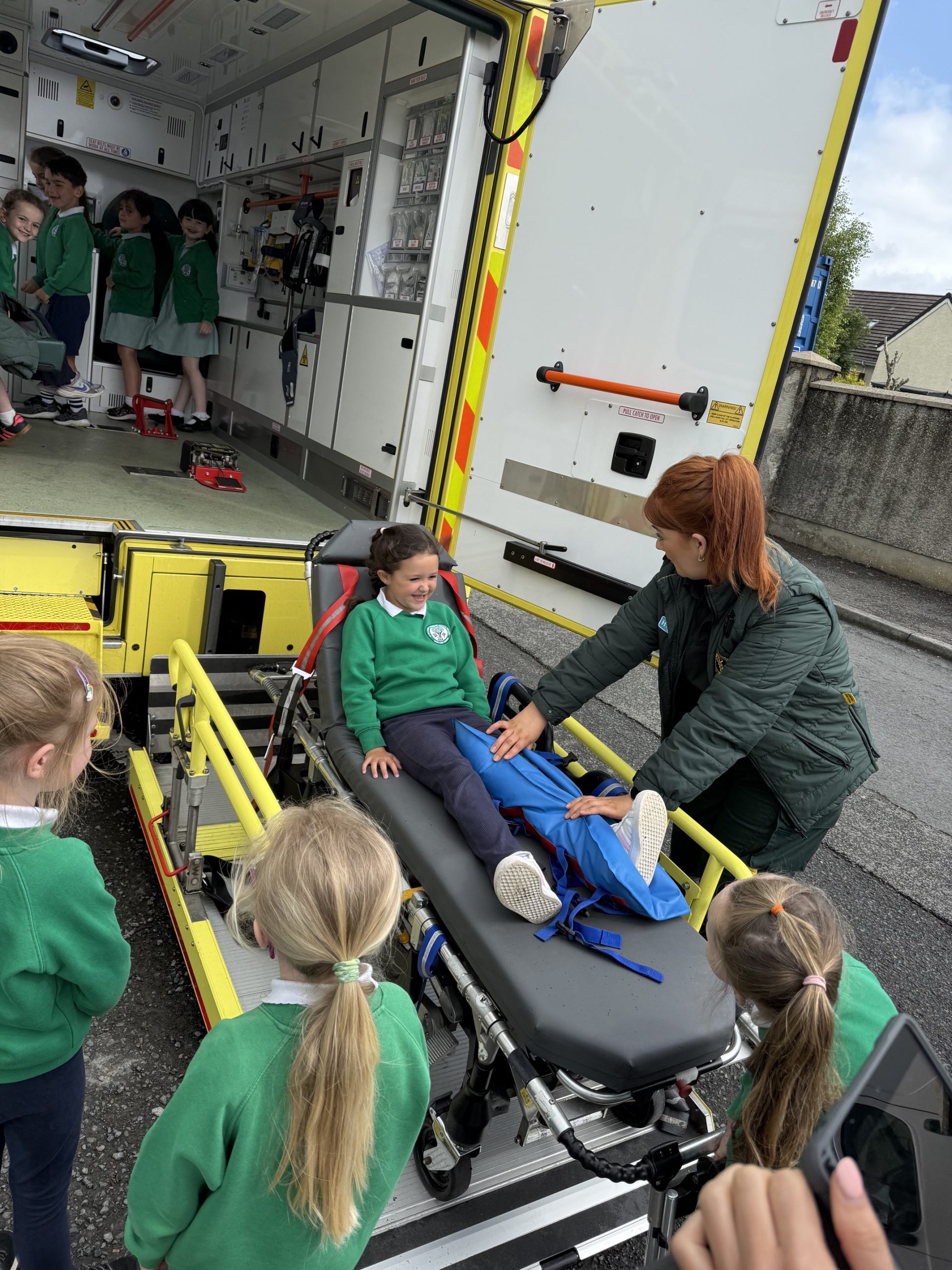 Child on a stretcher during a school visit